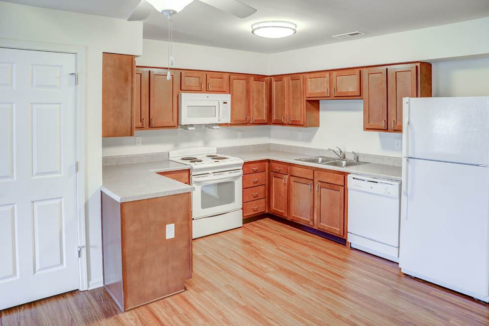 Spacious kitchen with wood-style flooring at Hayden House in Springfield, Ohio