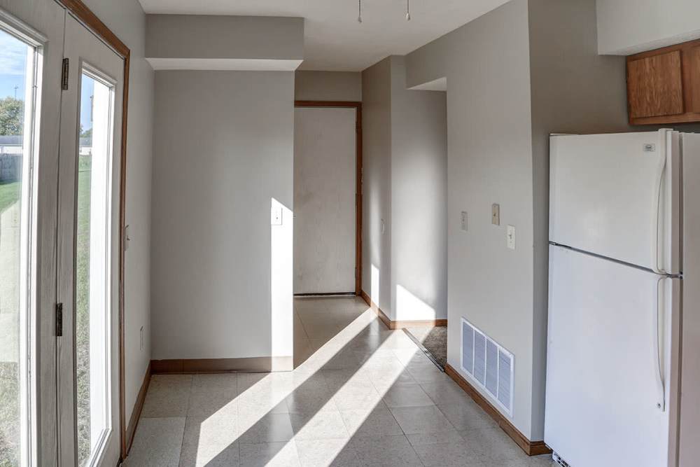 Well-lit kitchen with a refrigerator at Ivy Glen in Washington Court House, Ohio 