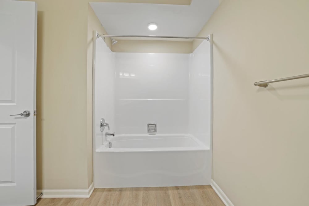 Bright bathroom featuring a white tub at Kershaw Greene II in Athens, Ohio