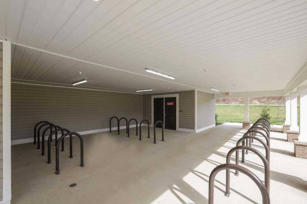 Covered bike rack area with multiple bike stands at Kershaw Greene II in Athens, Ohio