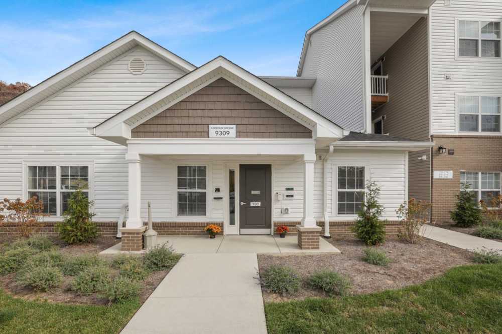 Charming apartment entrance with landscaped garden and welcoming porch at Kershaw Greene II in Athens, Ohio