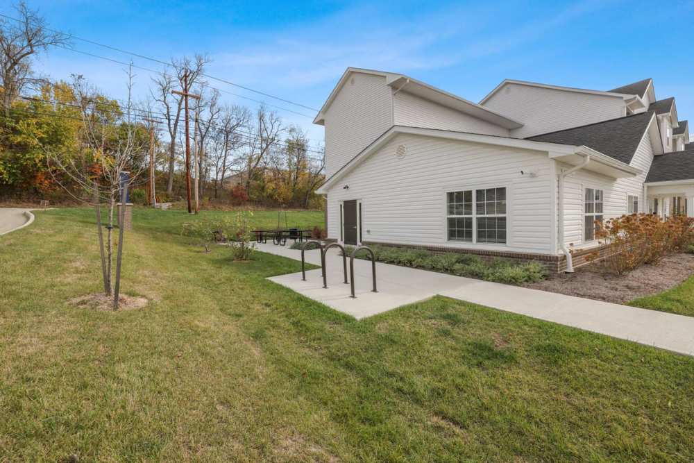 Apartment exterior with bike rack and lawn at Kershaw Greene II in Athens, Ohio