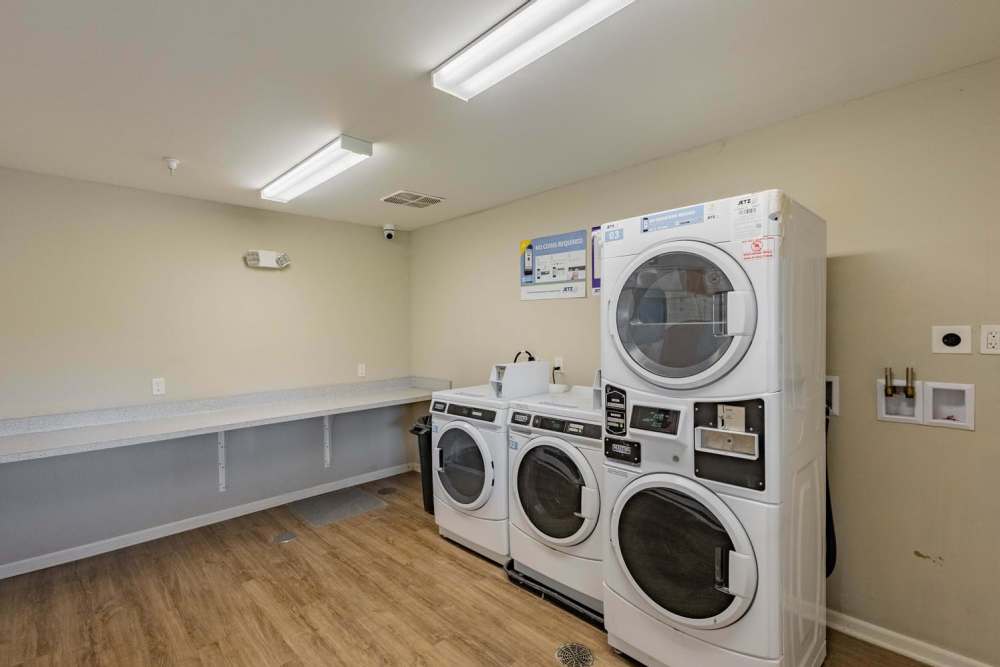 Laundry room with modern washers and dryers at Kershaw Greene II in Athens, Ohio