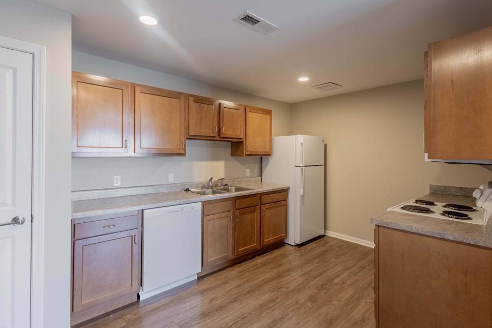 Modern kitchen with wood-style flooring at Kershaw Greene II in Athens, Ohio