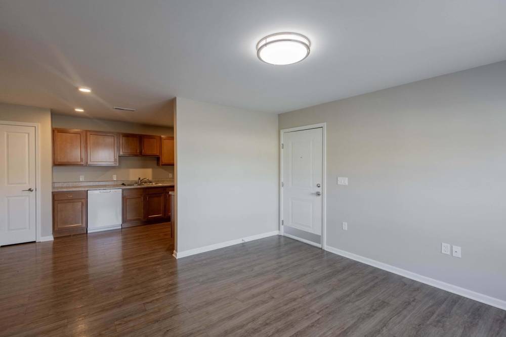 Open layout with modern kitchen featuring granite countertops and stainless steel appliances at Kershaw Greene II in Athens, Ohio