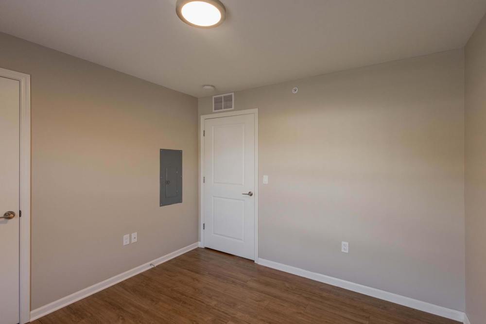 Empty room with neutral walls and featuring a closet and two doors at Kershaw Greene II in Athens, Ohio