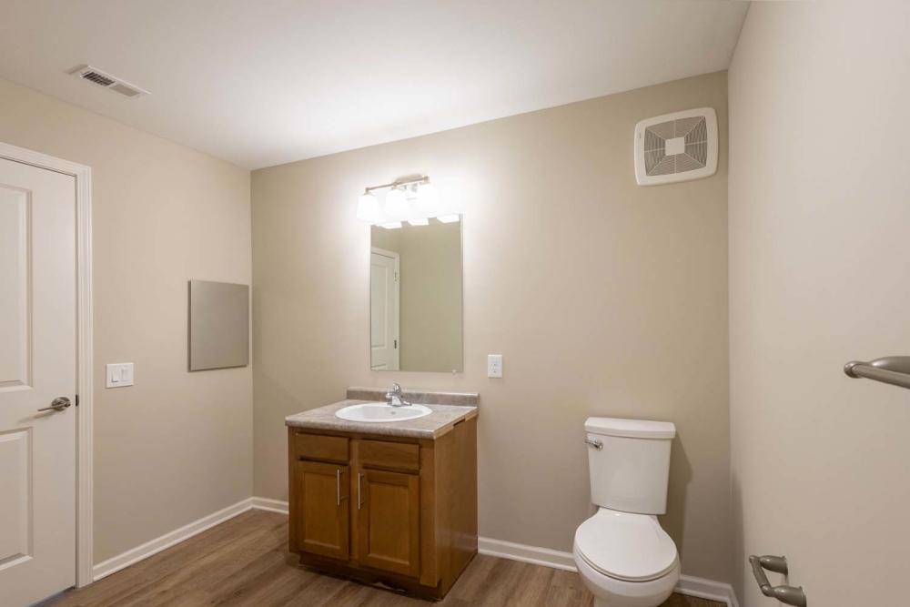 Spacious bathroom with wood-style flooring at Starling Yard in Columbus, Ohio