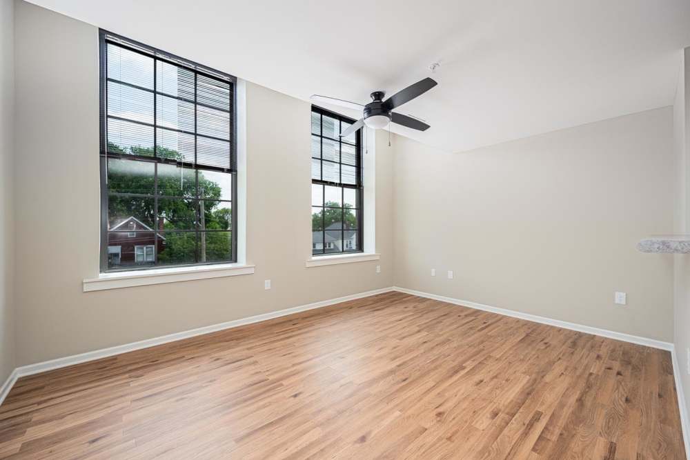 Spacious living area with wood-style flooring at Starling Yard in Columbus, Ohio