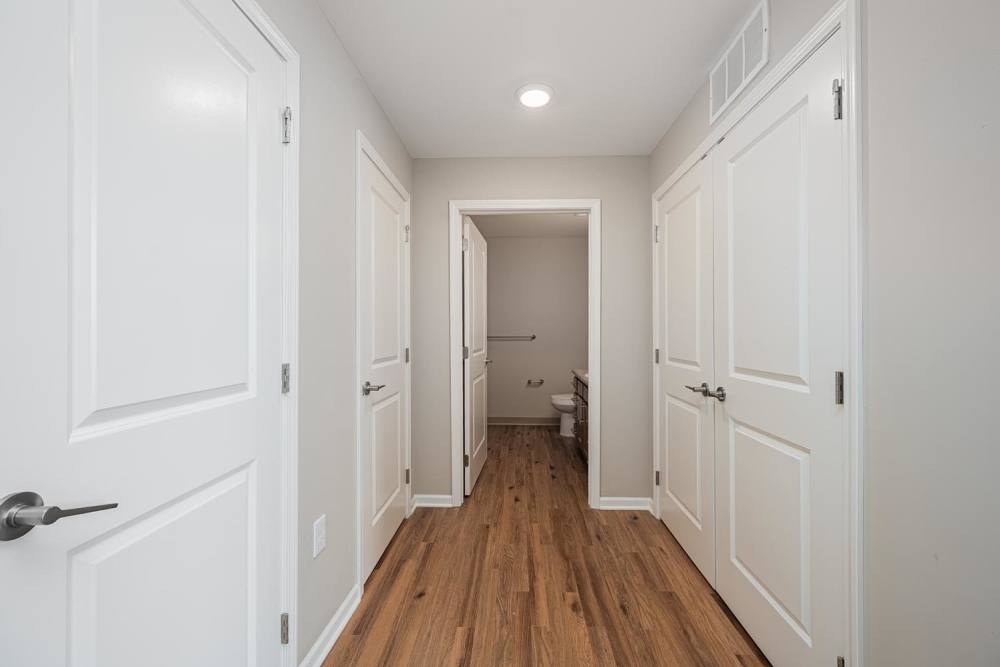 Bright hallway with wood-style flooring at Starling Yard in Columbus, Ohio