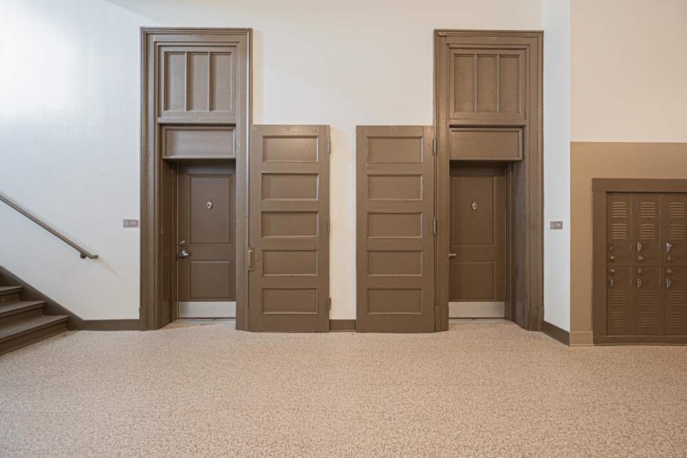 Interior hallway with two doors and staircase at Starling Yard in Columbus, Ohio