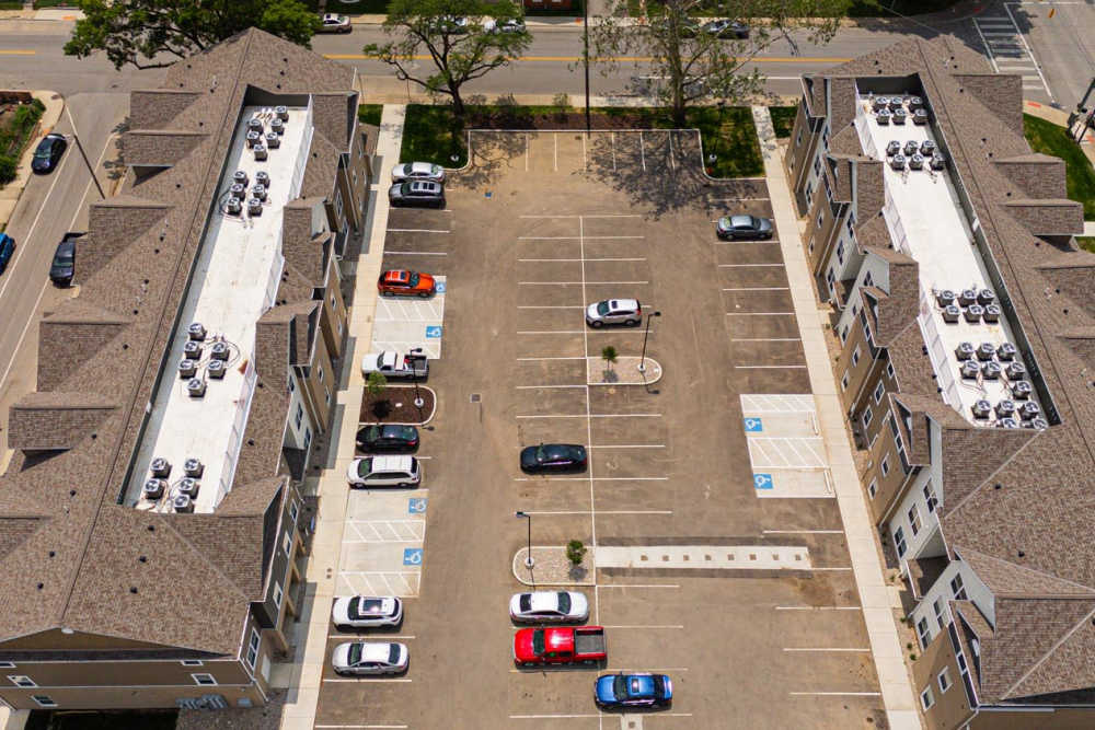 Aerial view of apartment community with parking spaces and landscaped areas at Starling Yard in Columbus, Ohio