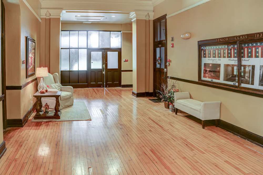 Welcoming lobby with hardwood floors at Washington School Apartments in Washington Court House, Ohio