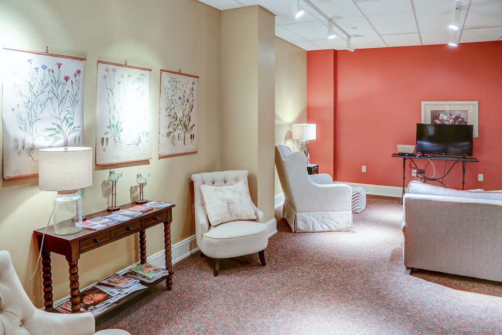 Cozy seating area with floral artwork at Washington School Apartments in Washington Court House, Ohio