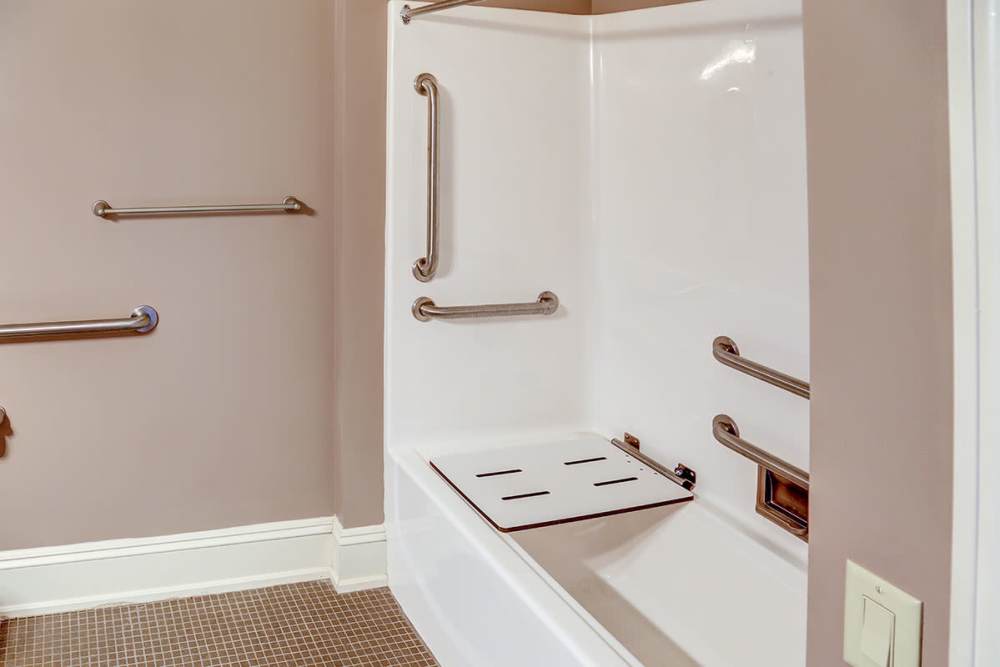 Accessible bathroom with grab bars at Washington School Apartments in Washington Court House, Ohio
