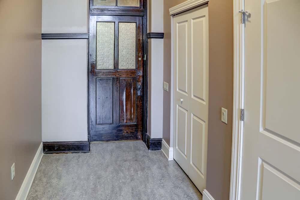 Wood-style flooring in entryway at Washington School Apartments in Washington Court House, Ohio