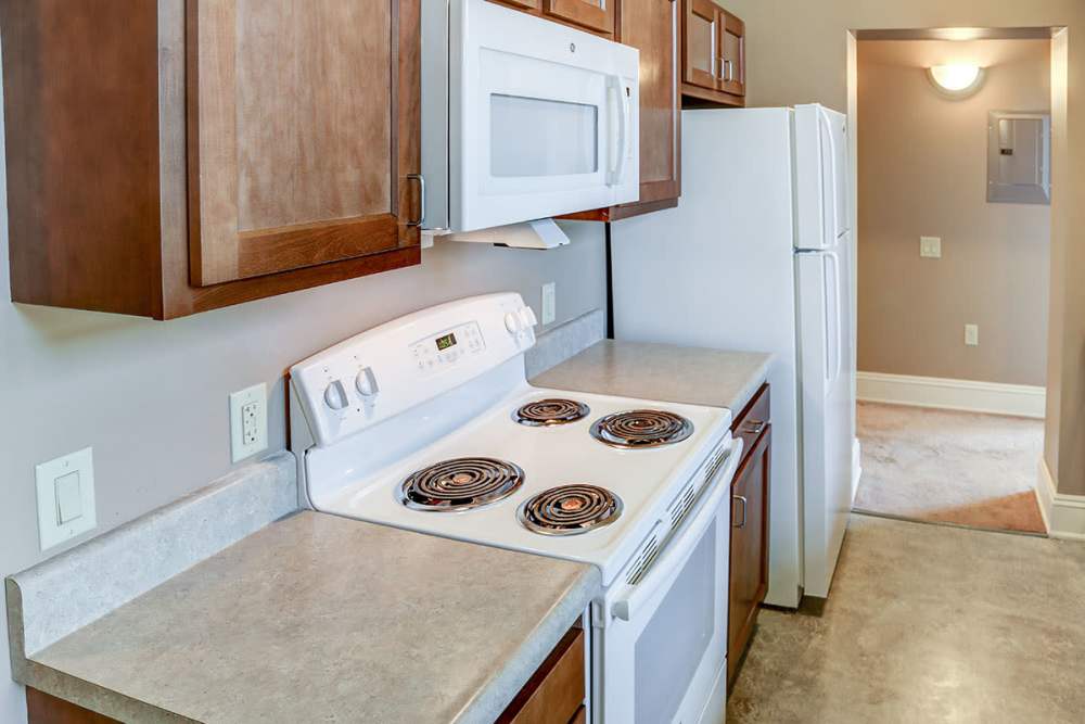Fully-equipped kitchen with modern appliances at Washington School Apartments in Washington Court House, Ohio