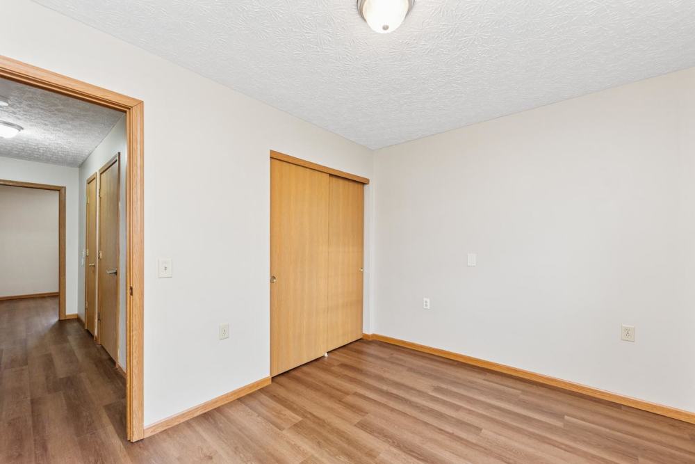 Spacious room with neutral walls and featuring closet doors at Webster Glen in Peebles, Ohio