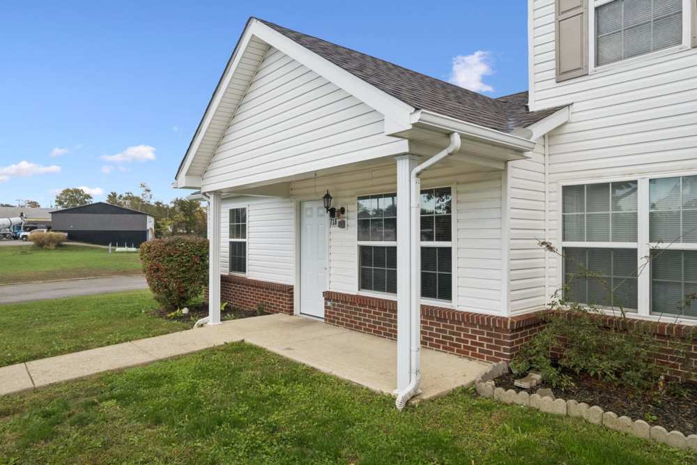 Welcoming entrance with landscaped yard at Webster Glen in Peebles, Ohio