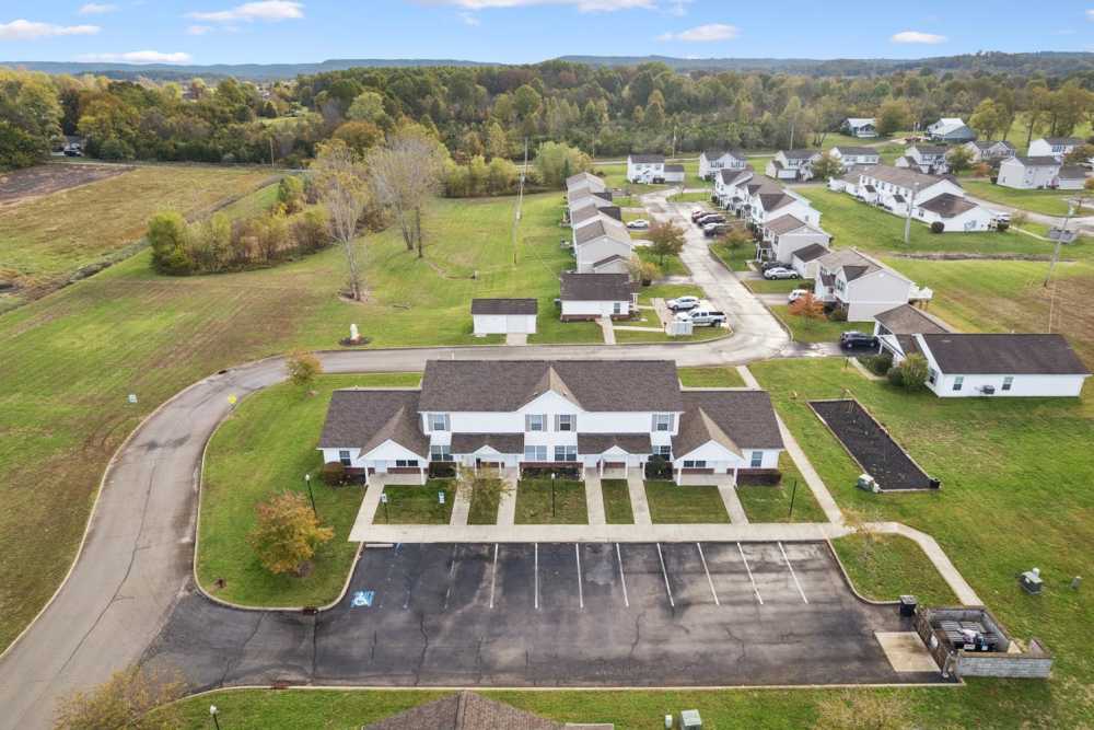Aerial view of a spacious apartment community with green lawns at Webster Glen in Peebles, Ohio