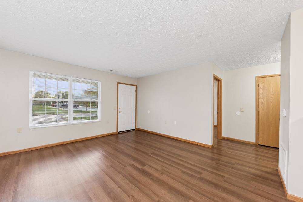 Spacious living area with large windows at Webster Glen in Peebles, Ohio