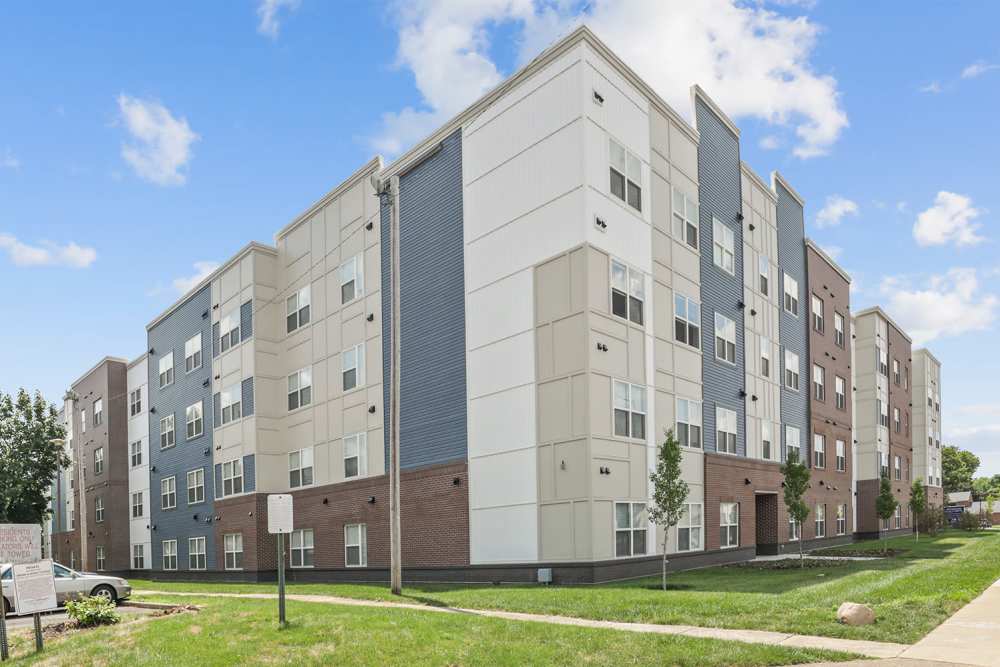 Building exterior with landscaped grounds at Atcheson Place Lofts in Columbus, Ohio