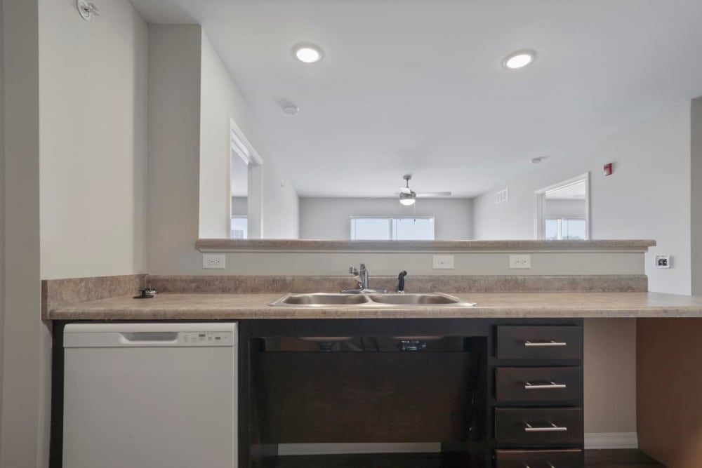 Open layout kitchen with granite countertops at Atcheson Place Lofts in Columbus, Ohio