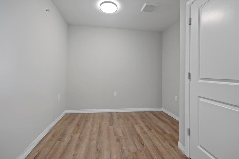 Bright, open layout with wood-style flooring at Atcheson Place Lofts in Columbus, Ohio