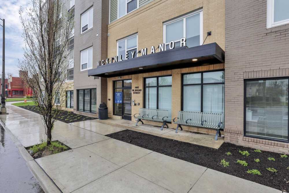 Benches in front of a building entrance at McKinley Manor in Columbus, Ohio