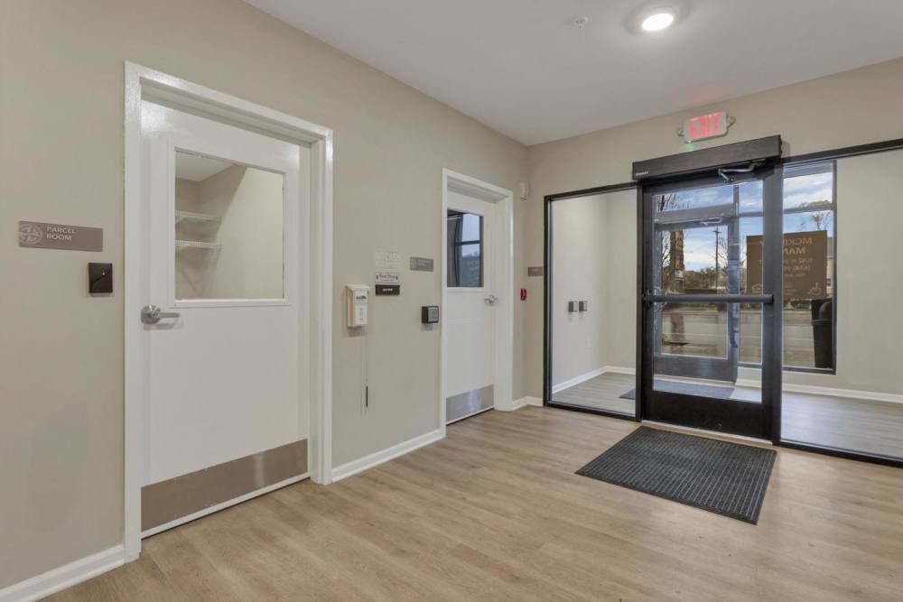 White door with glass panel and signage at McKinley Manor in Columbus, Ohio