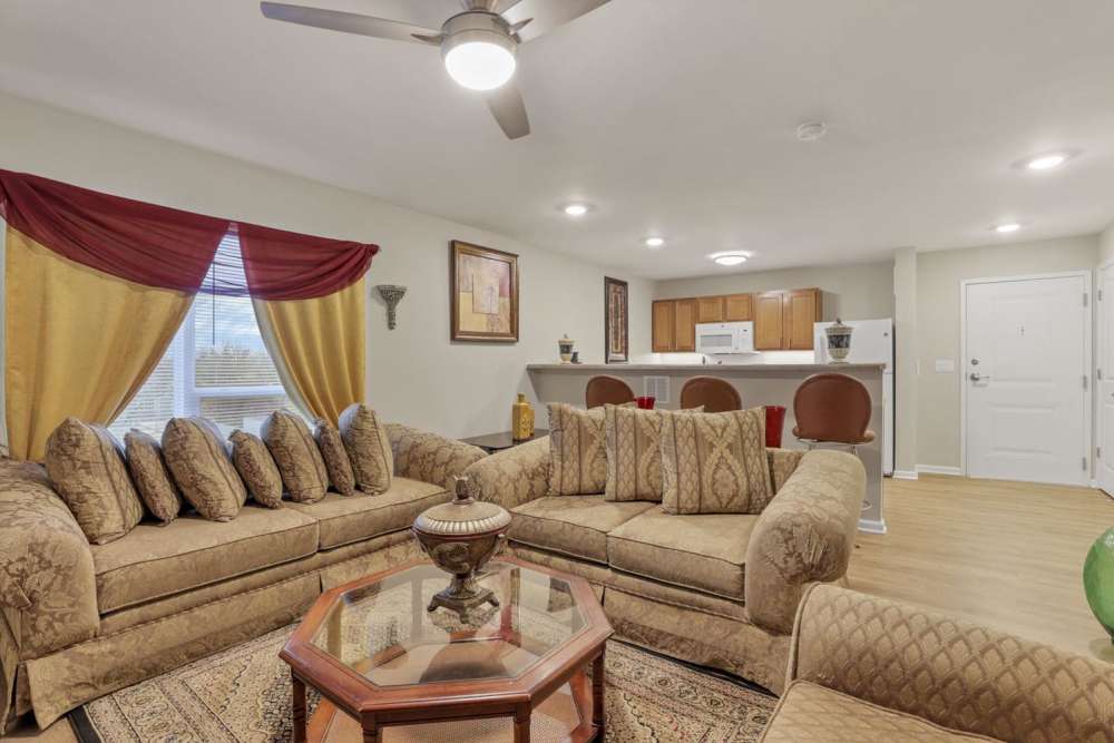 Spacious living room with a couch and a coffee table at McKinley Manor in Columbus, Ohio 