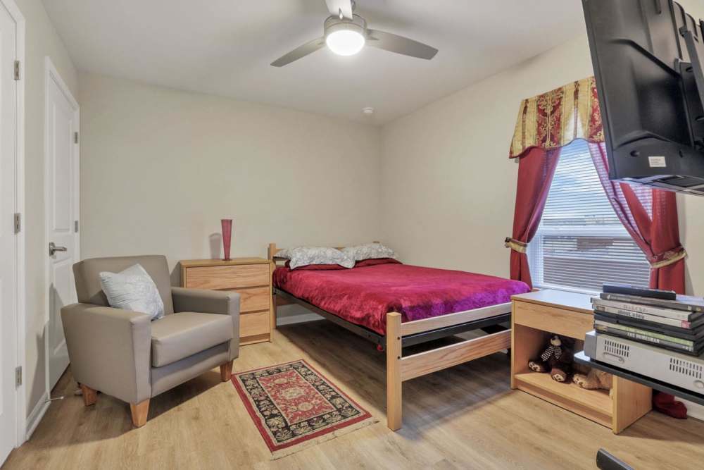 Bedroom with a window and a comfortable bed at McKinley Manor in Columbus, Ohio 