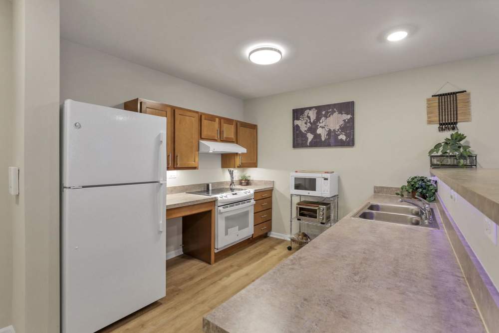 Modern kitchen with a refrigerator at McKinley Manor in Columbus, Ohio 