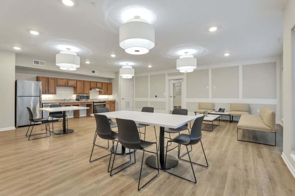 Light wood flooring with tables and chairs at McKinley Manor in Columbus, Ohio