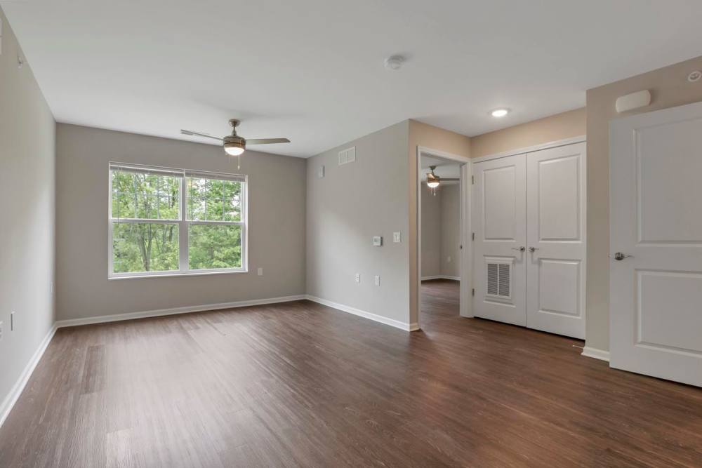 Wood-style flooring in spacious living area at Wendler Commons in Columbus, Ohio