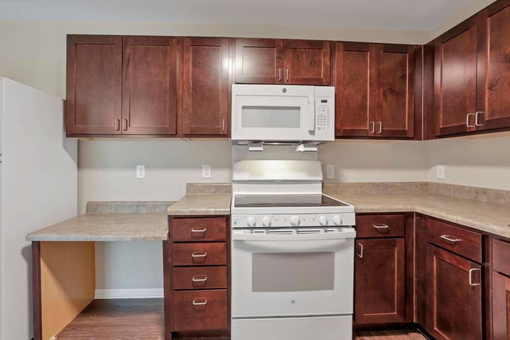 Kitchen with granite countertops and stainless steel appliances at Wendler Commons in Columbus, Ohio