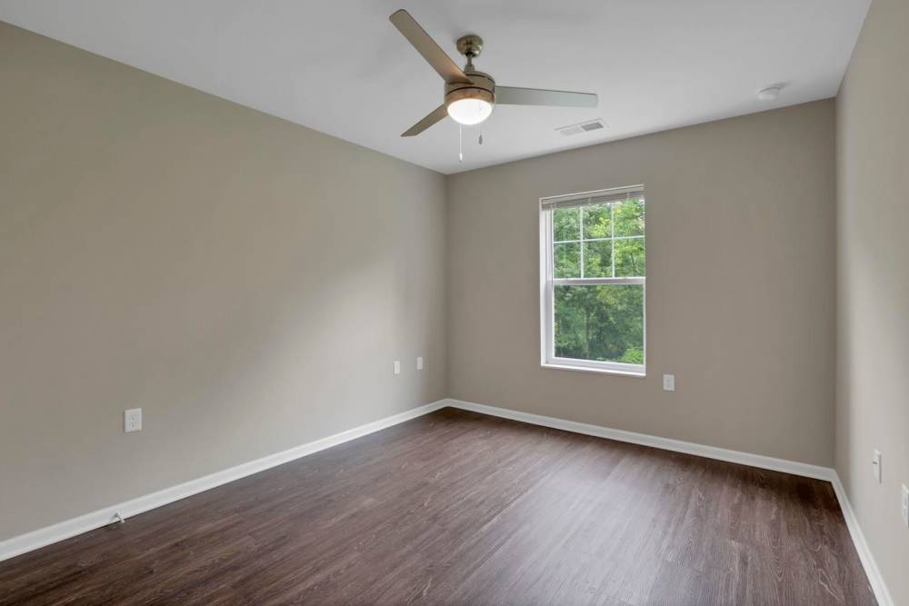 Wood-style flooring in spacious bedroom at Wendler Commons in Columbus, Ohio