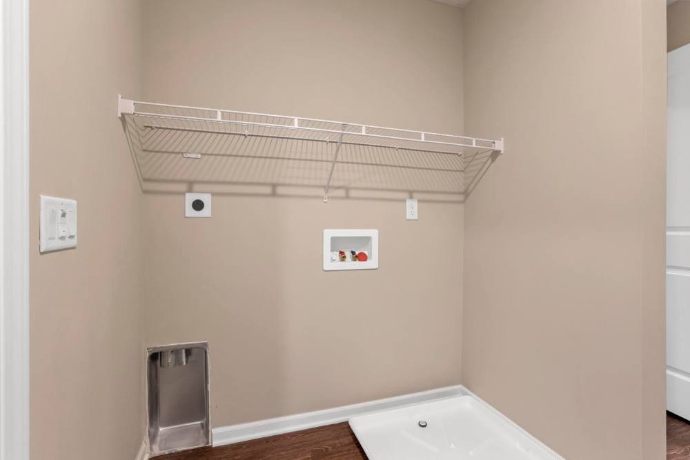 Laundry area with shelving at Wendler Commons in Columbus, Ohio