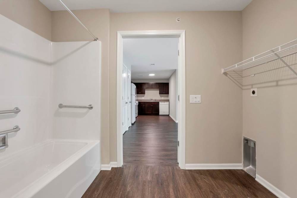 Wood-style flooring in spacious bathroom at Wendler Commons in Columbus, Ohio
