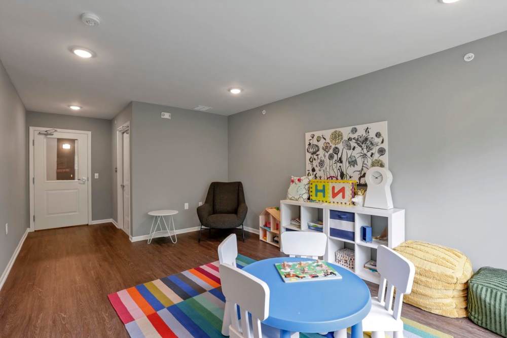 Colorful rug with children's play area at Wendler Commons in Columbus, Ohio