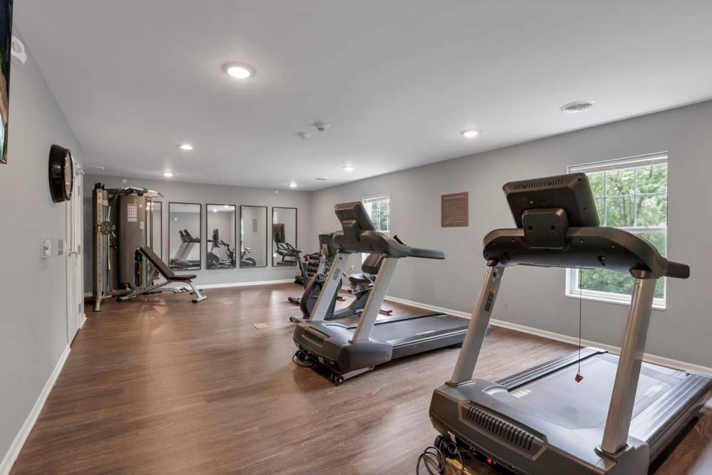 Bright fitness center with wood-style flooring at Wendler Commons in Columbus, Ohio