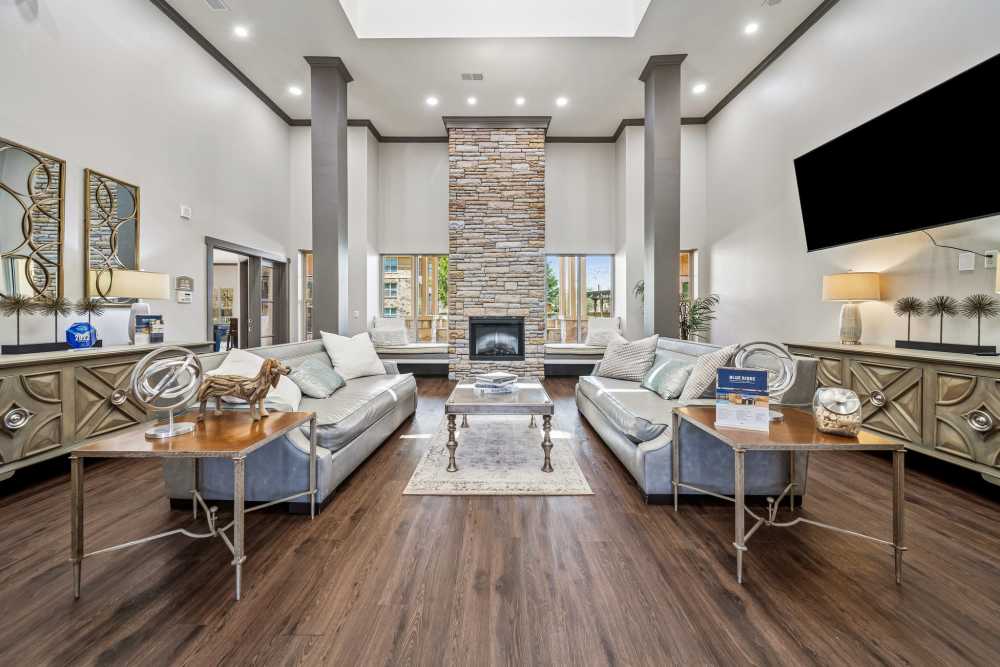Lounge area with wall mounted tv in clubhouse at Blue Ridge in Midland, Texas