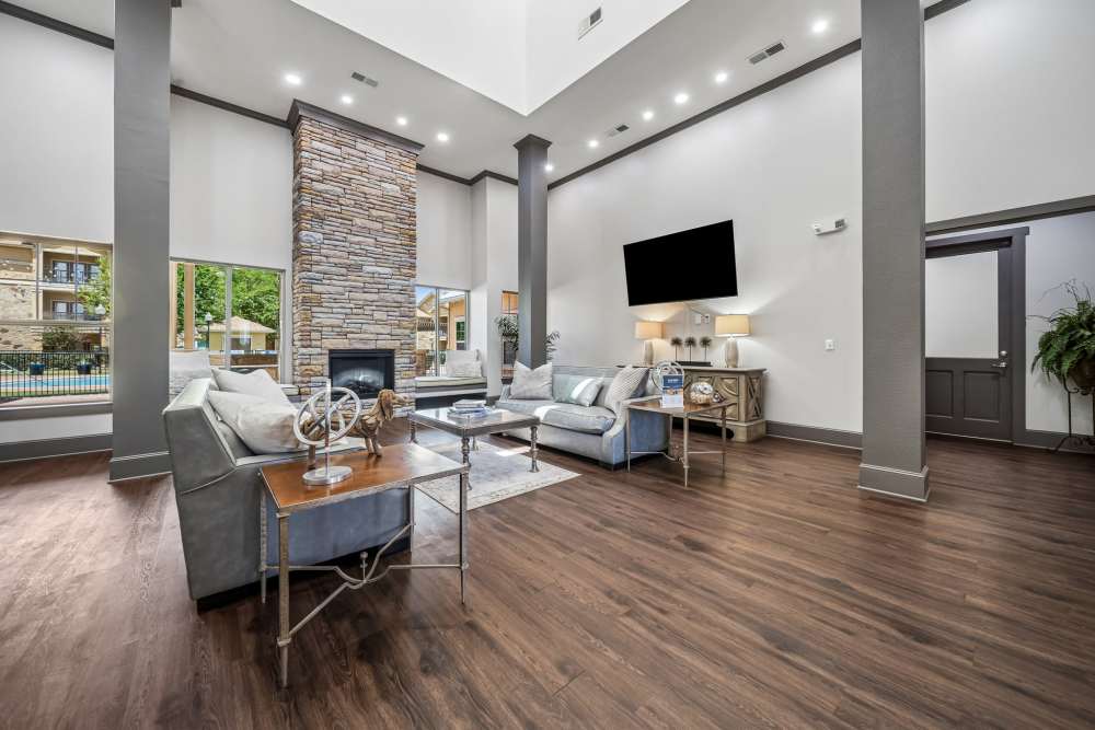 Lounge area with wall mounted tv in clubhouse at Blue Ridge in Midland, Texas