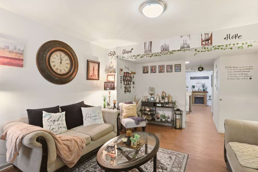 Furnished living room with access to kitchen at Chambersburg Family Townhomes in Chambersburg, Pennsylvania