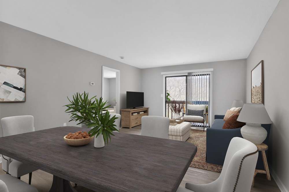 Cozy living room with modern decor and plants at The Residences at Talcott in Weatogue, Connecticut