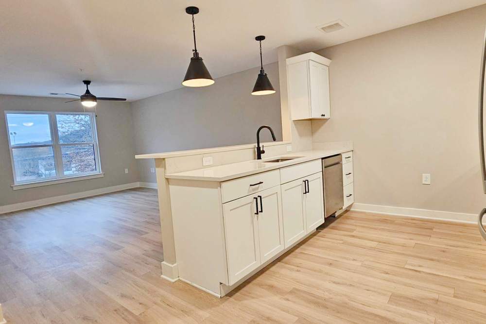 Modern kitchen with island and open layout at The Doris On Main in Wheeling, West Virginia