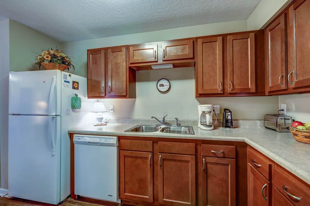 Kitchen with a refrigerator at Willoughbeach Terrace Senior Living in Willowick, Ohio 