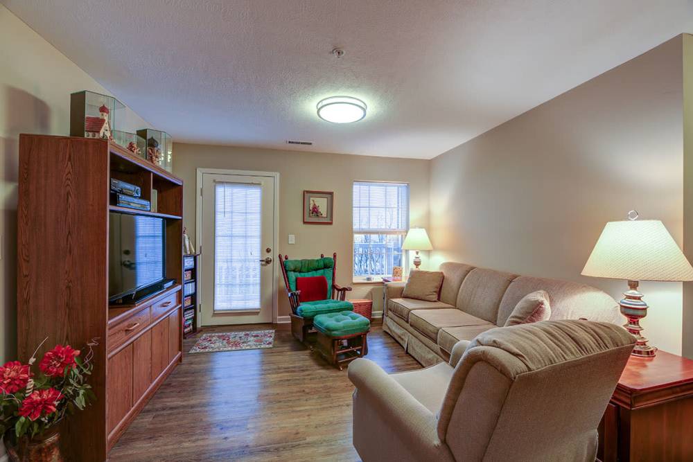 Cozy couch in the living room at Willoughbeach Terrace Senior Living in Willowick, Ohio 