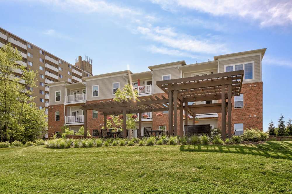 Building exterior with greenery all around at Willoughbeach Terrace Senior Living in Willowick, Ohio 