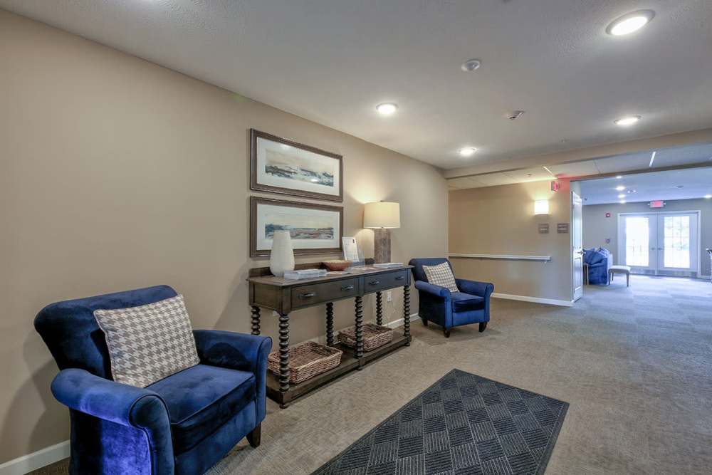 Well-lit clubhouse with a couch at Willoughbeach Terrace Senior Living in Willowick, Ohio 