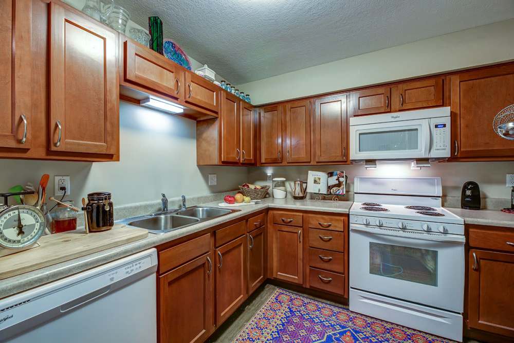 Kitchen with wooden cabinets at Willoughbeach Terrace Senior Living in Willowick, Ohio 
